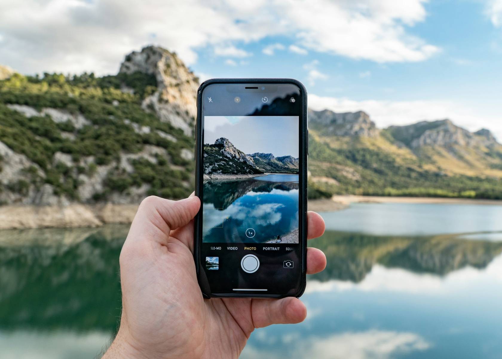 Smartphone displaying a slow-motion video and a portrait photo with the text "SLO-MO VIDEO" and "PHOTO PORTRAIT SQUA."